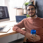 E-commerce web development: building online stores that sell. handsome programmer in headphones listening to mus 2023 11 27 04 56 48 utc